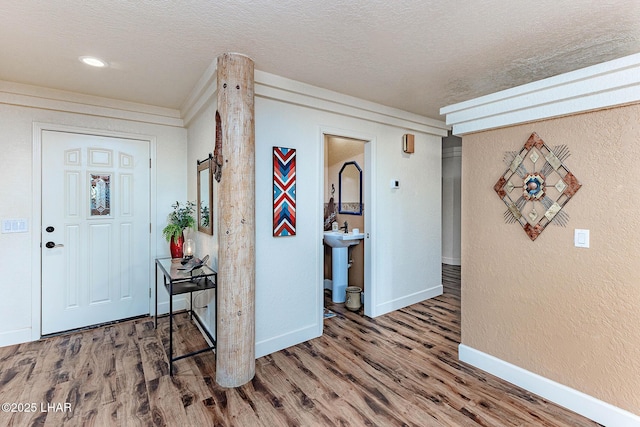 875 Wallingford Pl, Lake Havasu City, AZ 86406 - entrance foyer featuring a textured ceiling, wood finished floors, and a textured wall