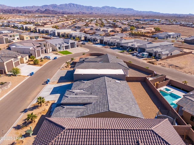 drone / aerial view featuring a mountain view