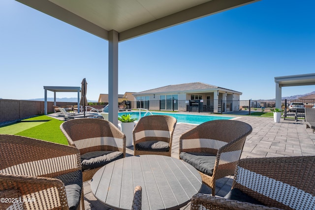 view of swimming pool with a patio