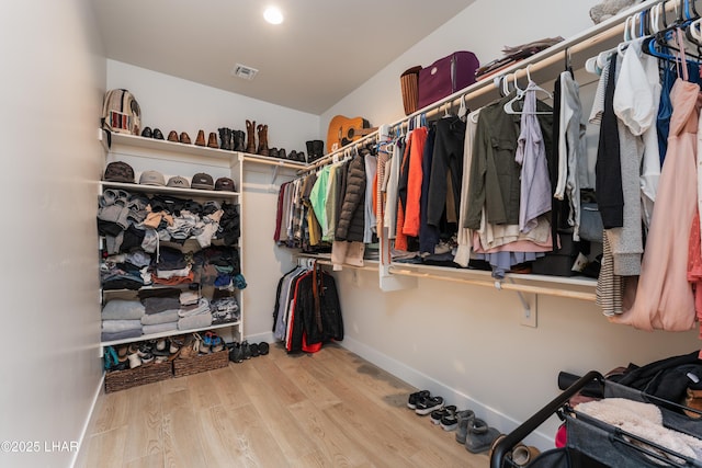 walk in closet featuring light hardwood / wood-style floors