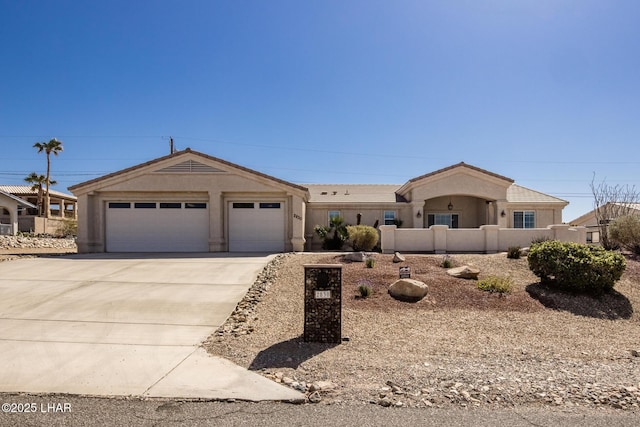 ranch-style house featuring a garage, concrete driveway, fence, and stucco siding