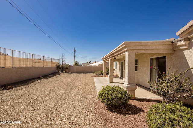 view of yard featuring a fenced backyard and a patio