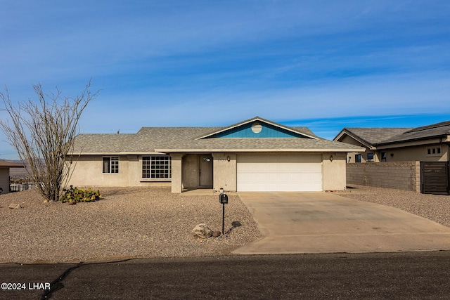 ranch-style home with a garage