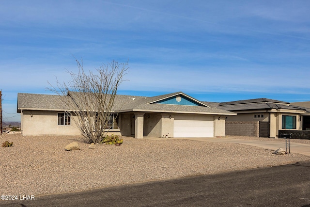 ranch-style house featuring a garage