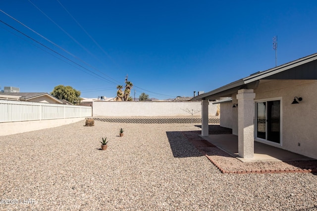 view of yard featuring a patio and a fenced backyard