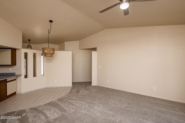 unfurnished living room with carpet flooring, lofted ceiling, and a ceiling fan