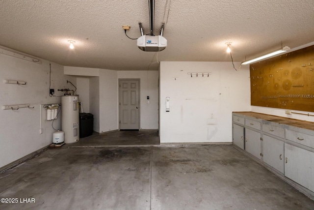 garage featuring a garage door opener and electric water heater