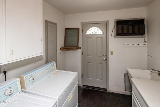 laundry room with washer and dryer and cabinet space