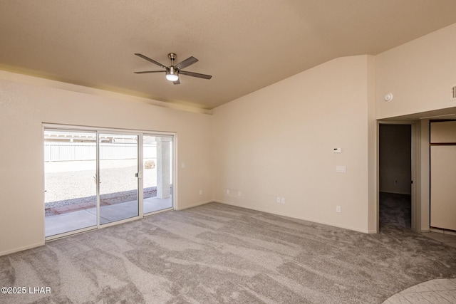 carpeted empty room featuring lofted ceiling and a ceiling fan