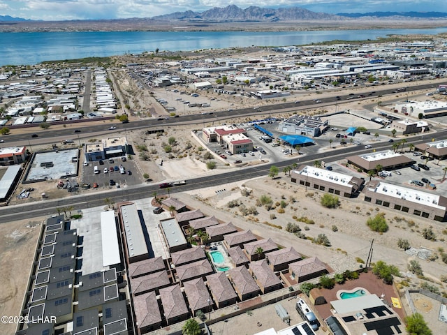 drone / aerial view with a water and mountain view