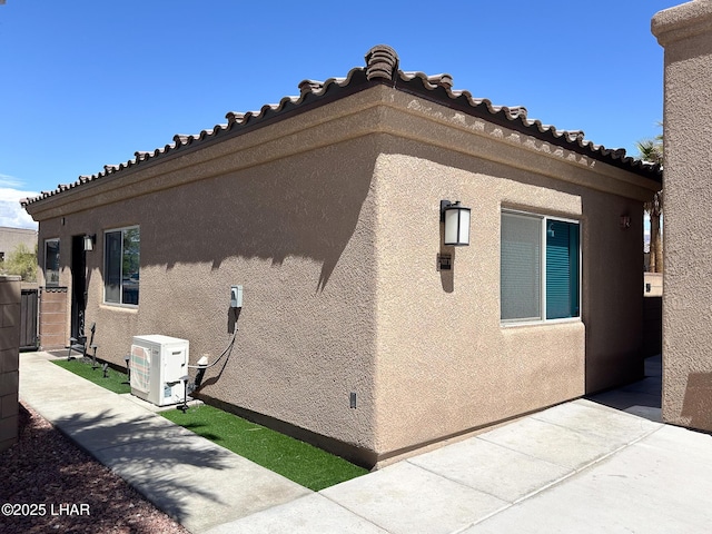 view of property exterior with stucco siding