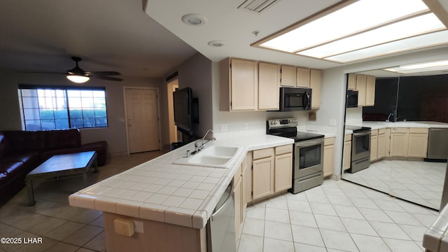 2095 Mesquite Ave Unit 27, Lake Havasu City, AZ 86403 - kitchen with appliances with stainless steel finishes, tile counters, a sink, light tile patterned floors, and ceiling fan