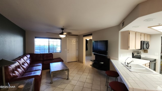 2095 Mesquite Ave Unit 27, Lake Havasu City, AZ 86403 - living area with ceiling fan and light tile patterned floors
