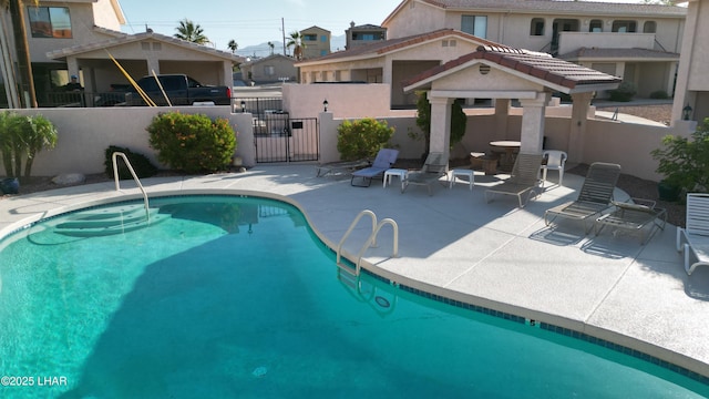 2095 Mesquite Ave Unit 27, Lake Havasu City, AZ 86403 - community pool with a gate, a patio, and a residential view