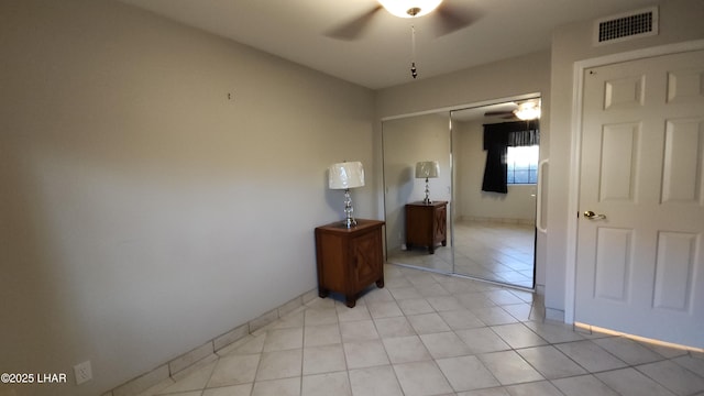 2095 Mesquite Ave Unit 27, Lake Havasu City, AZ 86403 - bedroom featuring a closet, light tile patterned floors, and a ceiling fan