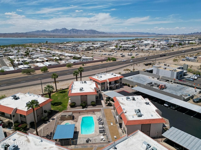 birds eye view of property featuring a water and mountain view