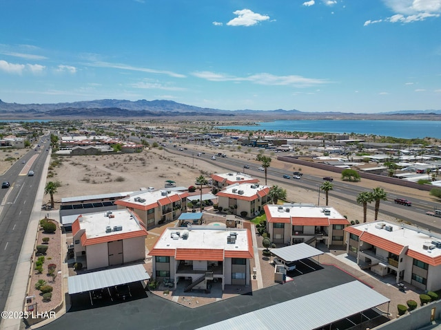 aerial view featuring a water and mountain view
