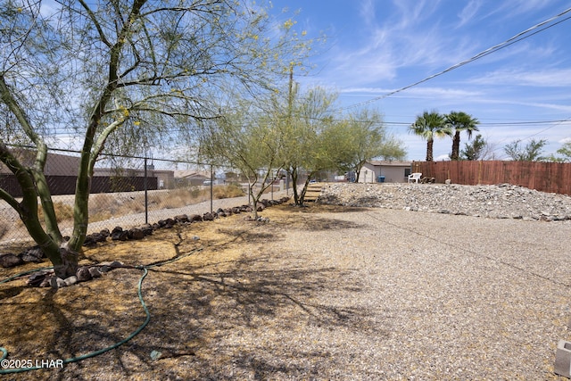 view of yard featuring fence