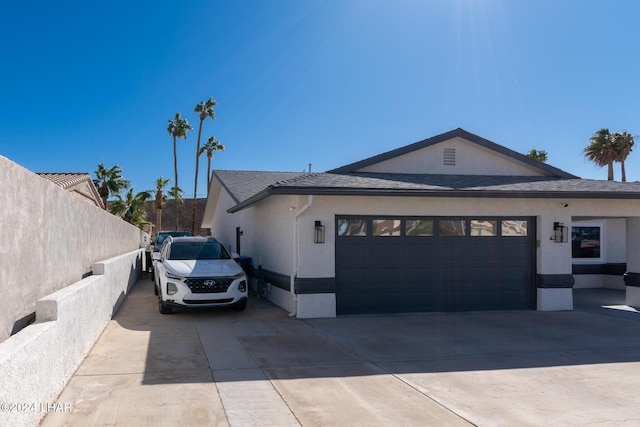 view of side of home featuring a garage