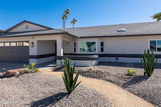 ranch-style home with a garage