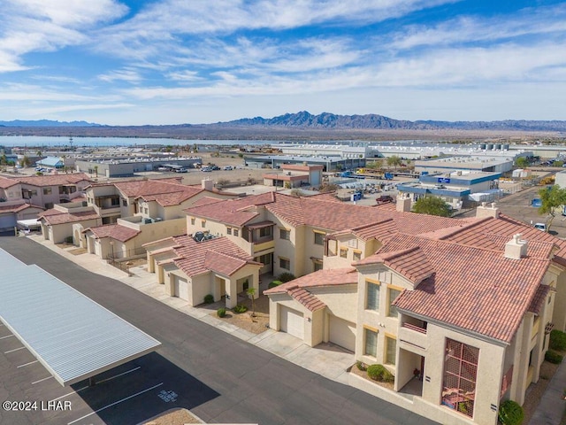 birds eye view of property featuring a mountain view