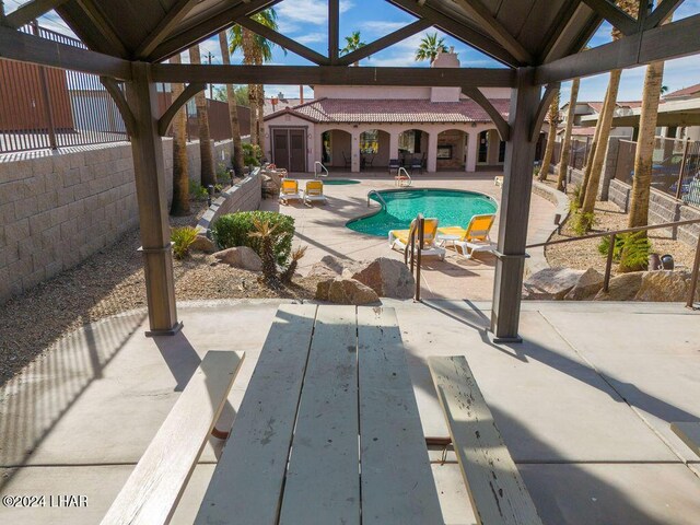 view of pool featuring a patio