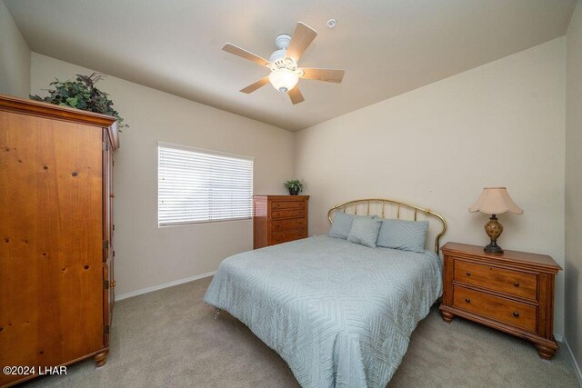 bedroom featuring ceiling fan and light colored carpet