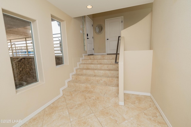 stairs featuring recessed lighting and baseboards