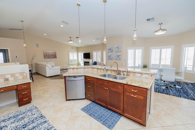 kitchen with a sink, visible vents, open floor plan, stainless steel dishwasher, and plenty of natural light