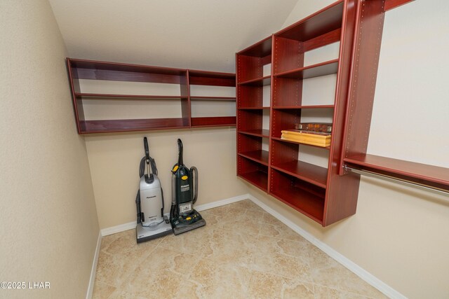 walk in closet featuring a dry bar