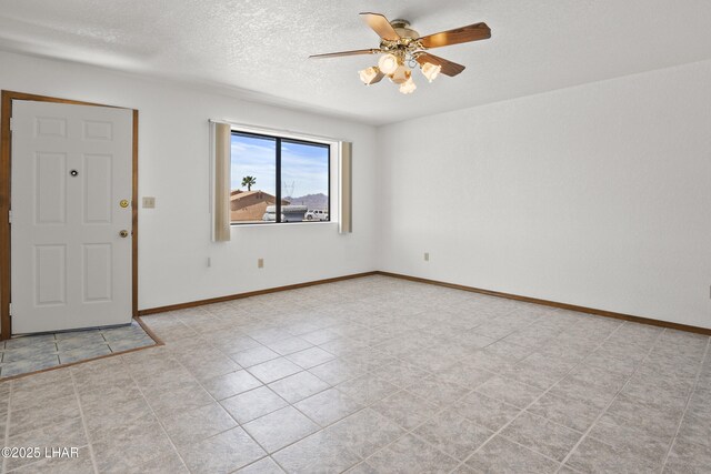 unfurnished living room featuring ceiling fan with notable chandelier