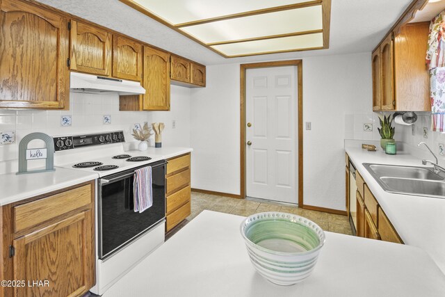 kitchen with ceiling fan, white range with electric cooktop, a textured ceiling, and light tile patterned floors