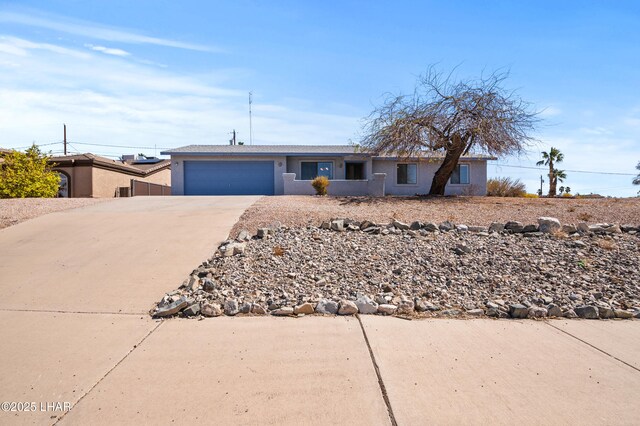 ranch-style home featuring a garage