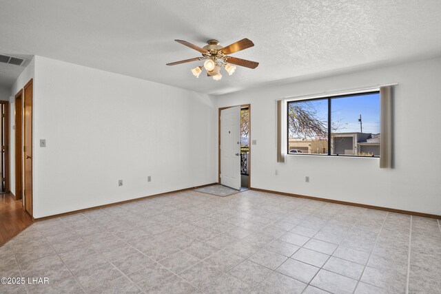 spare room with ceiling fan