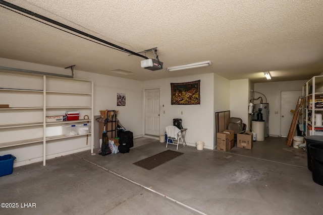 garage featuring a garage door opener and electric water heater