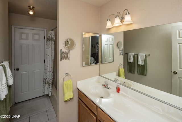 full bathroom with tile patterned floors, shower / bath combination with curtain, and vanity