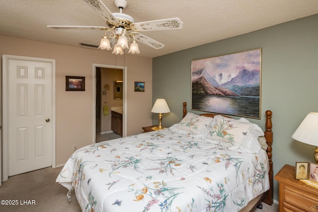 bedroom featuring carpet floors, a ceiling fan, a textured ceiling, and visible vents
