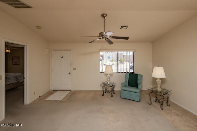 unfurnished room with visible vents, a ceiling fan, and carpet