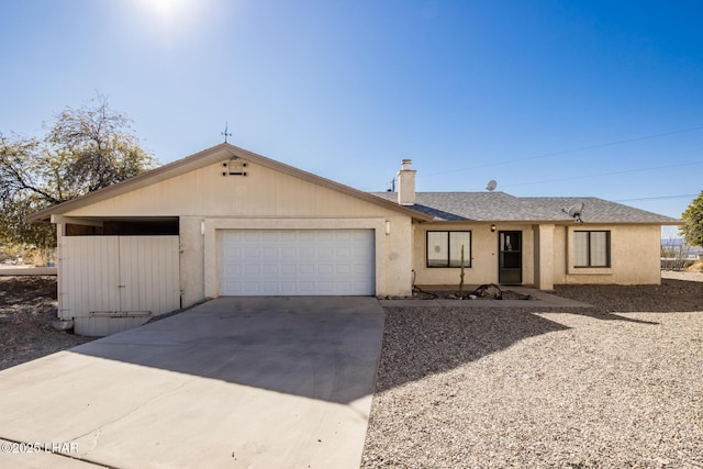 ranch-style home featuring a garage