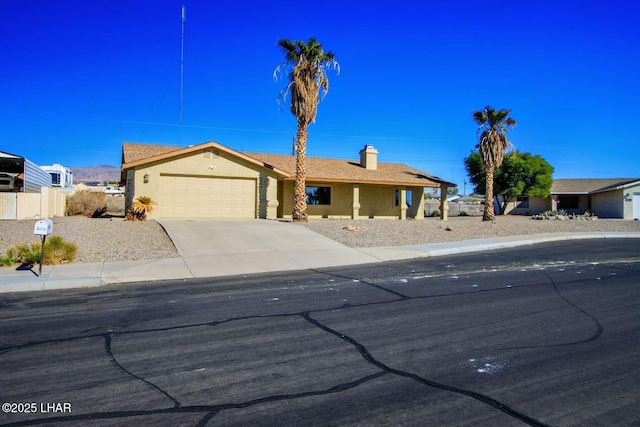 single story home featuring a garage