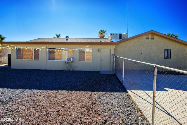 back of house featuring central AC