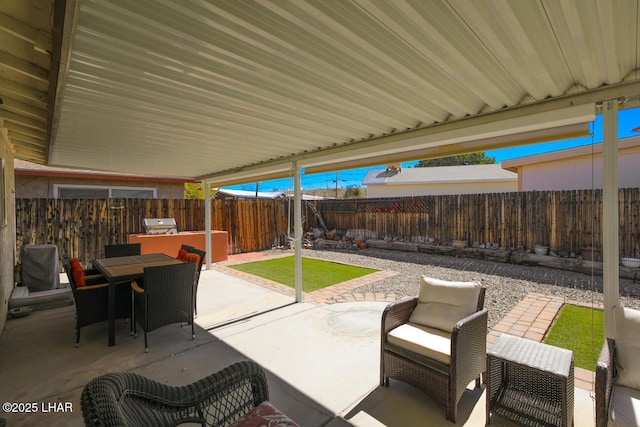 view of patio / terrace featuring outdoor dining space and a fenced backyard