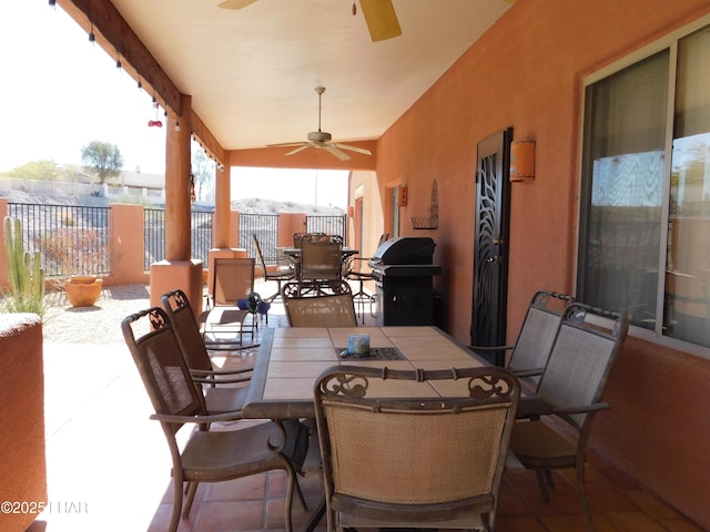 view of patio / terrace featuring ceiling fan and grilling area