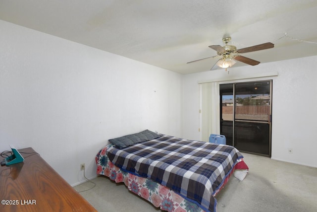 carpeted bedroom with access to outside, a ceiling fan, and baseboards