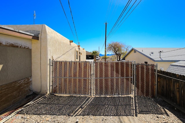 view of gate featuring fence