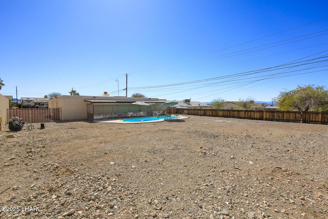 view of yard with a fenced backyard and a fenced in pool