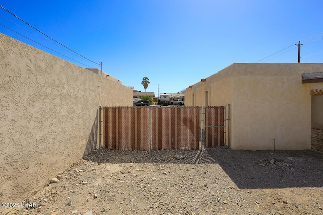 view of yard featuring a gate and fence