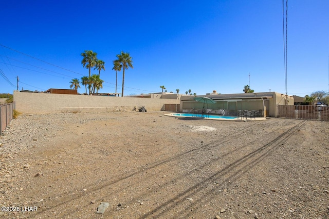 view of yard featuring a fenced in pool and a fenced backyard