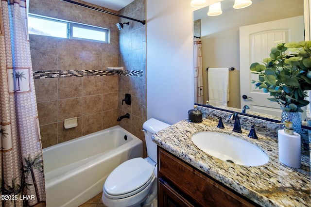 bathroom featuring toilet, shower / bath combo with shower curtain, and vanity