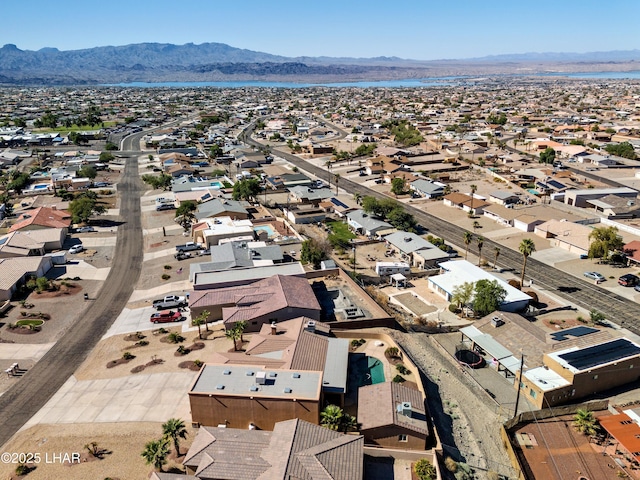 drone / aerial view featuring a residential view and a mountain view